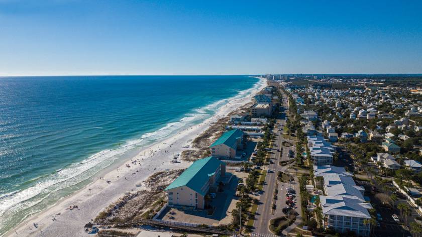 Destin Beach, Florida drone shot of beach with blue roof houses