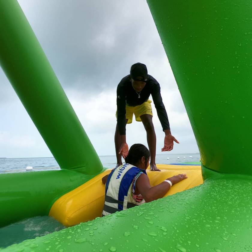 Secret Beach Waterpark Lifeguard helping child